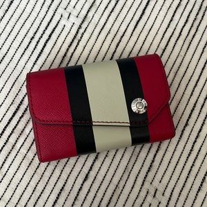 Henri Bendel business card case, like new condition except small tear in crease